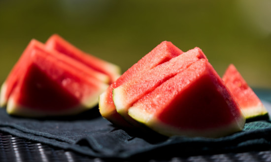 watermelon triangular cuts set on black cloth napkin on table