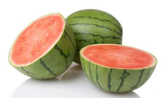 mini watermelon, one whole, one cut in half, white background