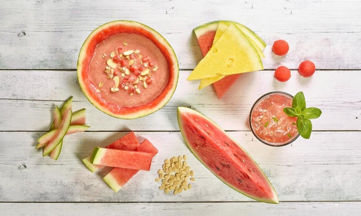 watermelon cuts, seeds, gazpacho on wooden background