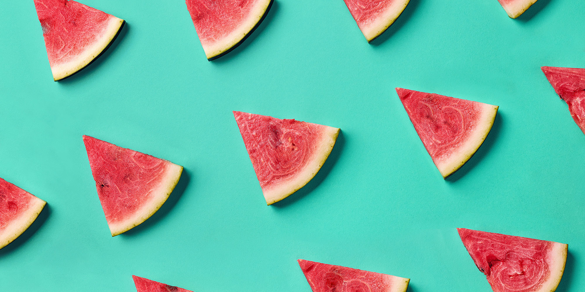 watermelon triangular cuts on aqua background
