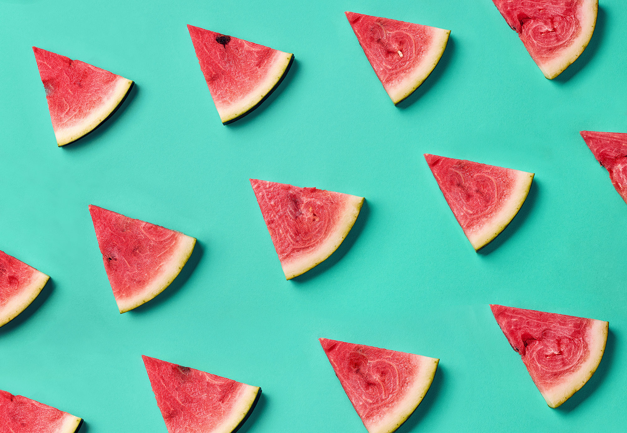 watermelon triangular cuts on aqua background