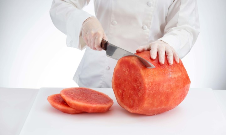 chef cutting watermelon slices