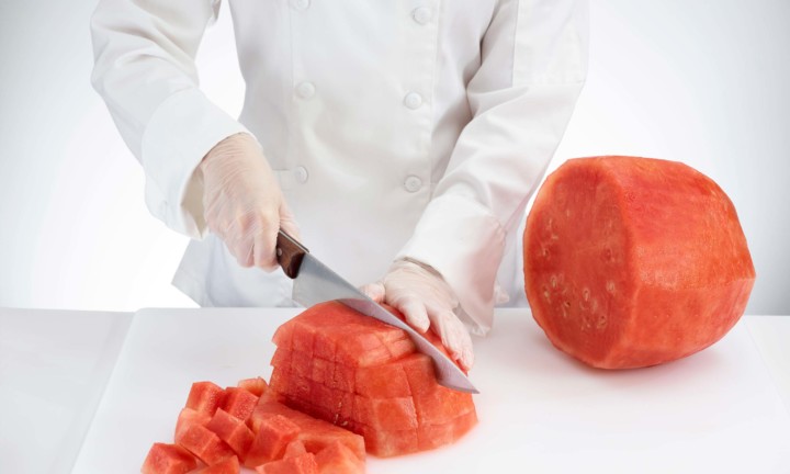 chef cutting flesh into chunks