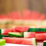 Side-view of slices of watermelon with slices of lime