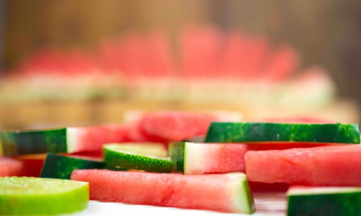 Side-view of slices of watermelon with slices of lime