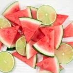 Slices of watermelon with lime slices, top view