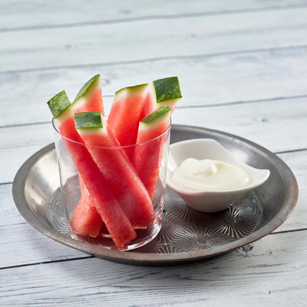 Watermelon Dippers in clear glass/cup, set in metal pan with small condiment dish with dip