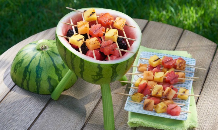 Watermelon Grill - carving with skewers of fruit on top of