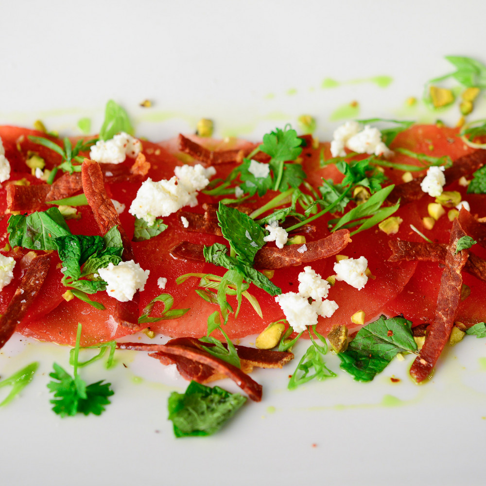 Watermelon Carpaccio with Fried Prosciutto and Basil Oil.