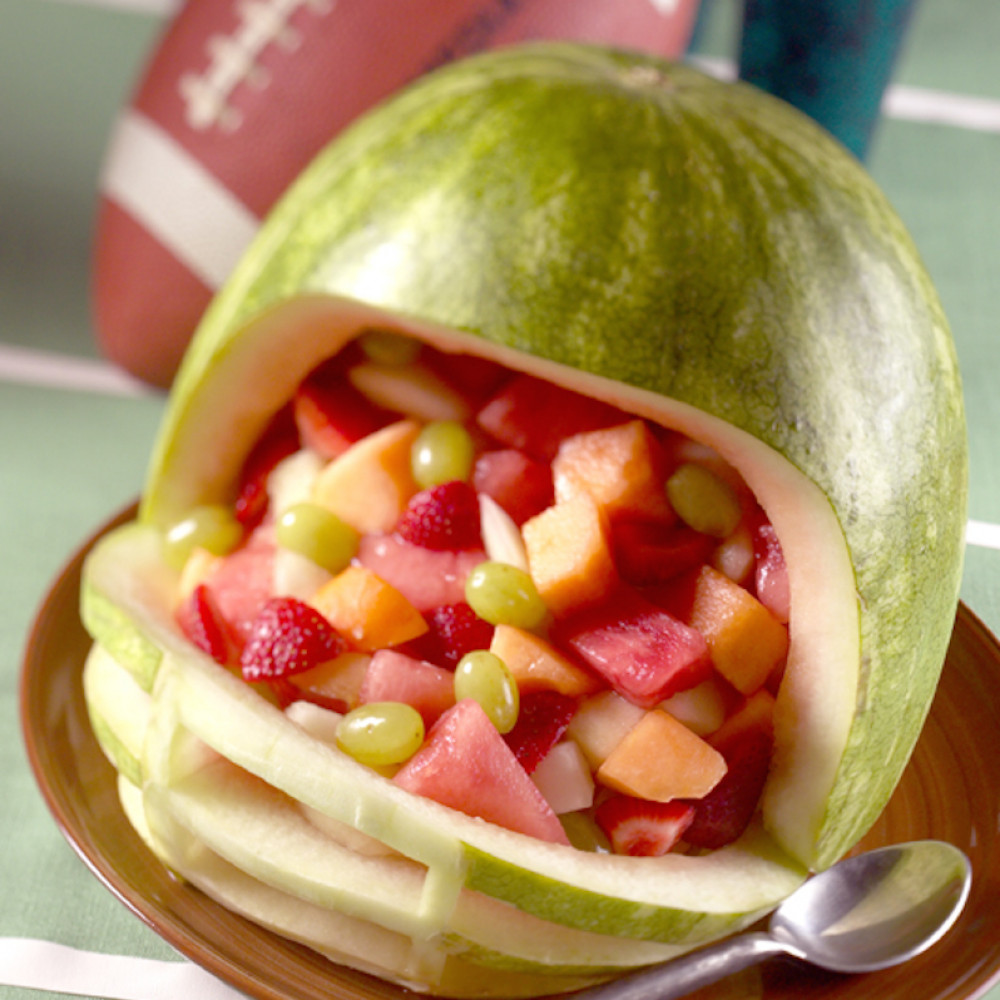Watermelon carved like a football helmet