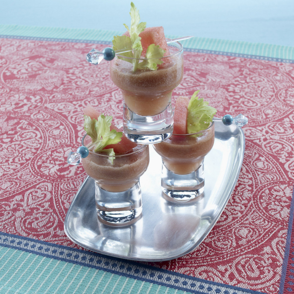 Three ginger celery shooters on a tray