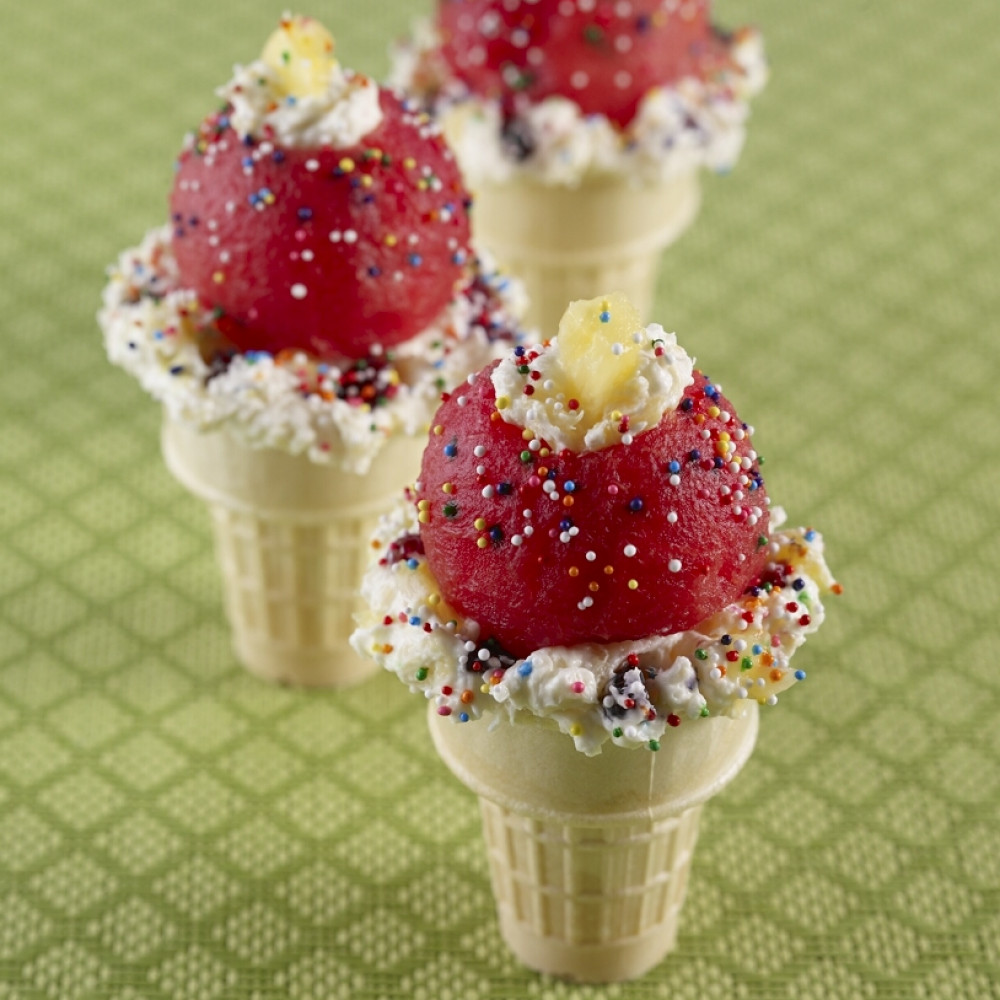 Ice cream cone sundaes on a green backdrop