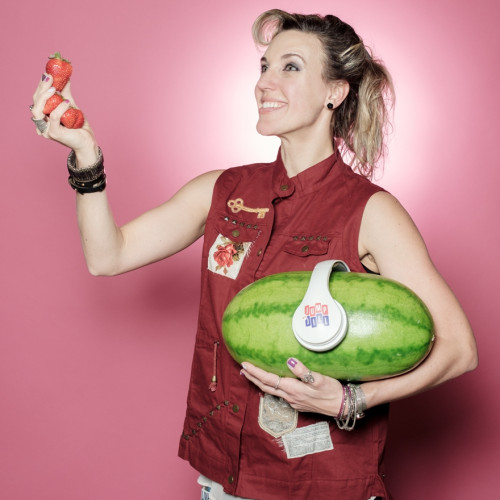 Jump with Jill holding watermelon and strawberries