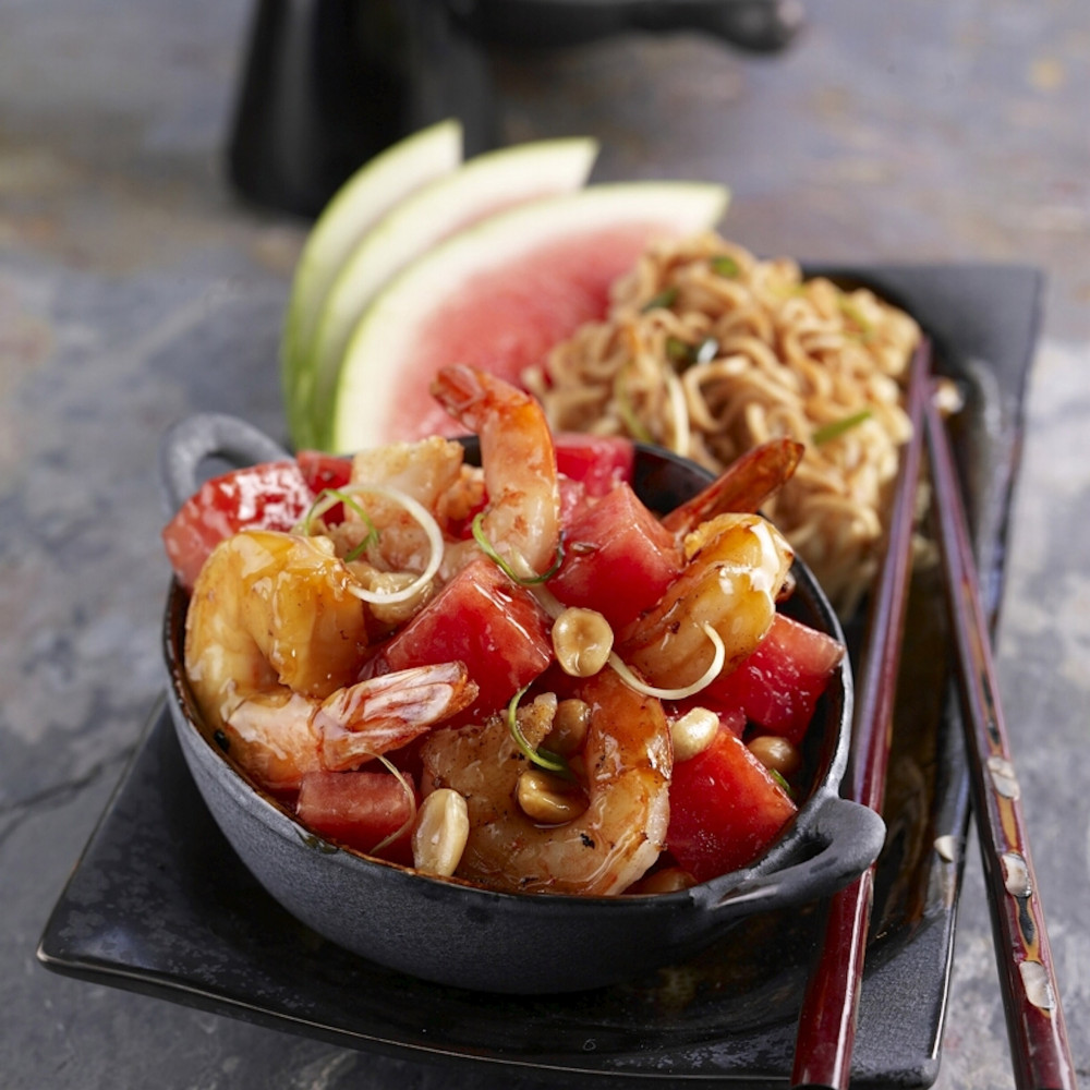 Kung Pao shrimp with watermelon served on a plate