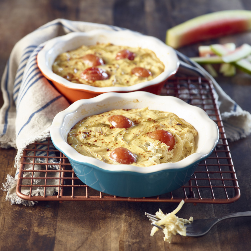 Two Watermelon Rind Quiche in mini ceramic pie dishes with watermelon rind in background.