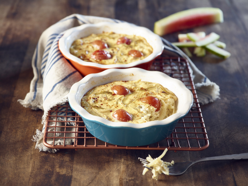 Two Watermelon Rind Quiche in mini ceramic pie dishes with watermelon rind in background.