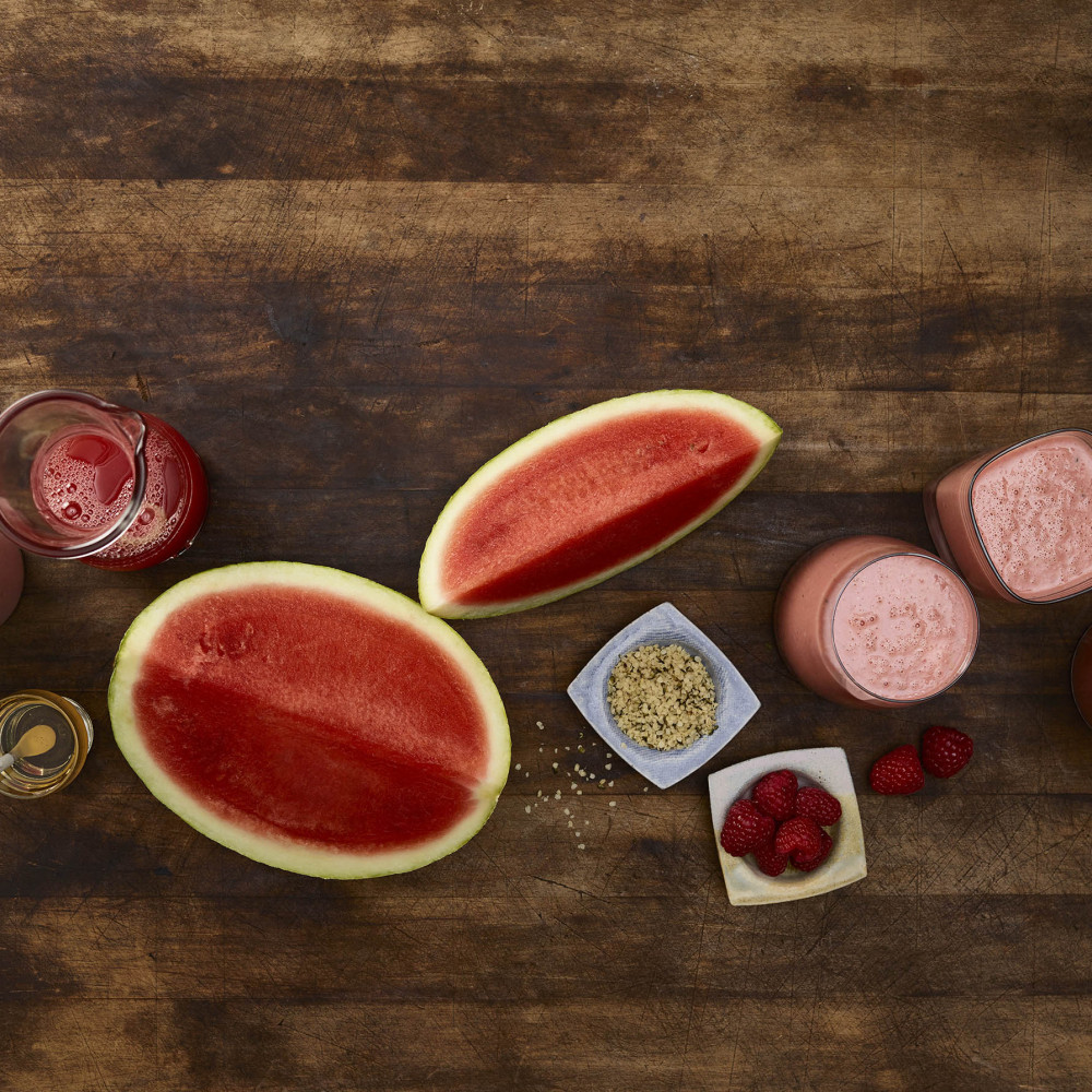 Overhead view of rosy red smoothie and ingredients