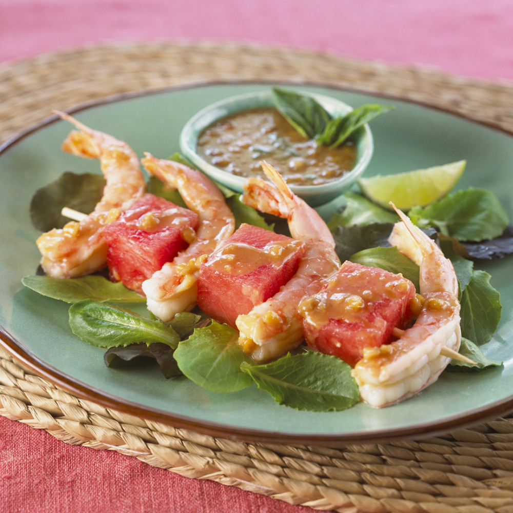 Shrimp and watermelon skewers on plate