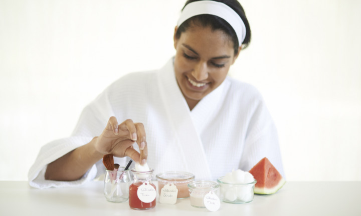 watermelon scrub with woman in robe preparing to apply