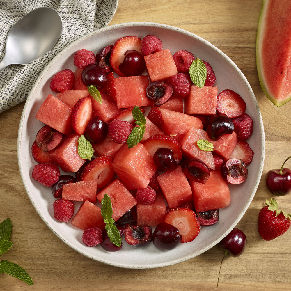 Red salad with watermelon raspberries, cherries and strawberries