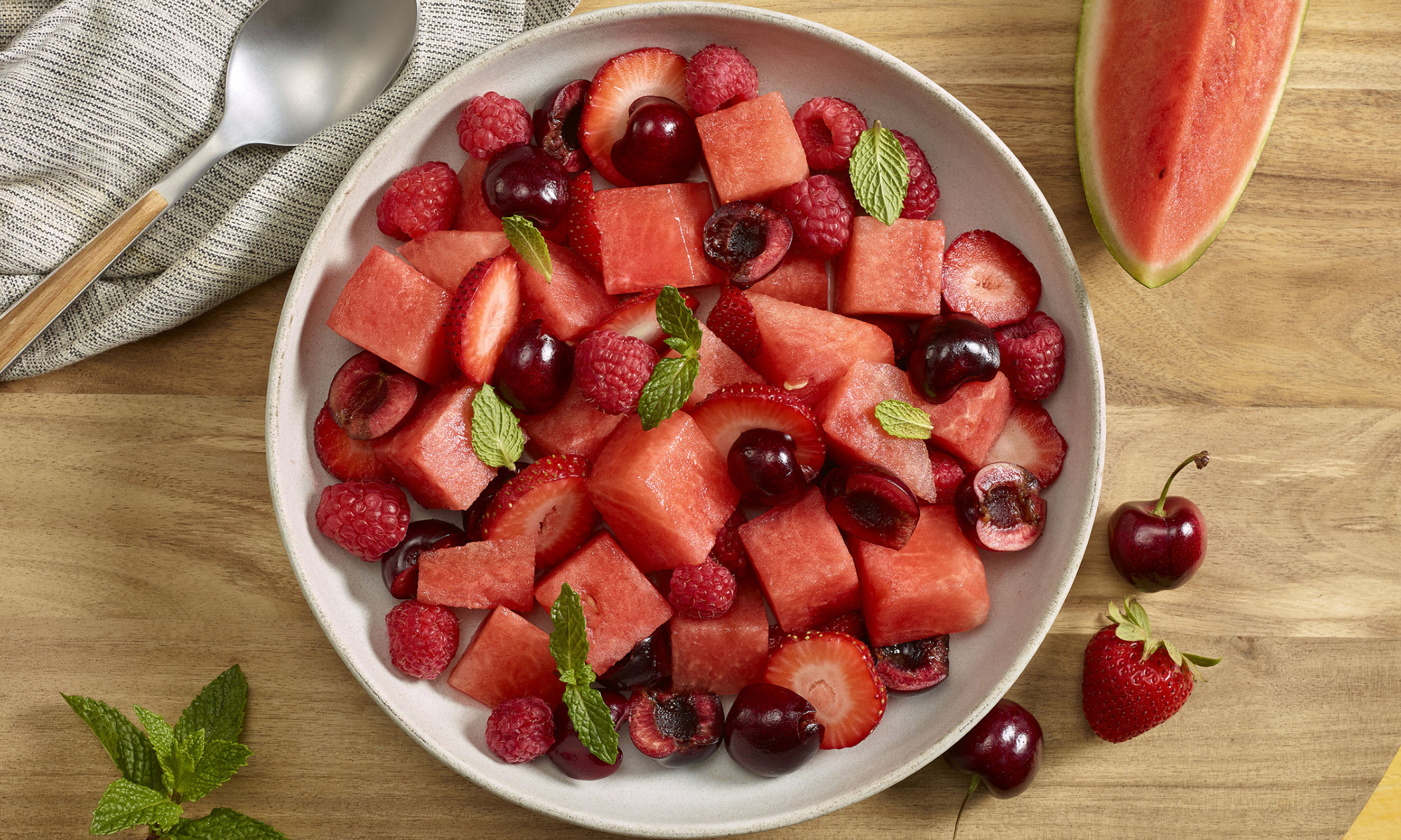 Red salad with watermelon raspberries, cherries and strawberries