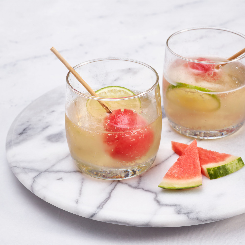Two glasses of prosecco with frozen watermelon ice pops