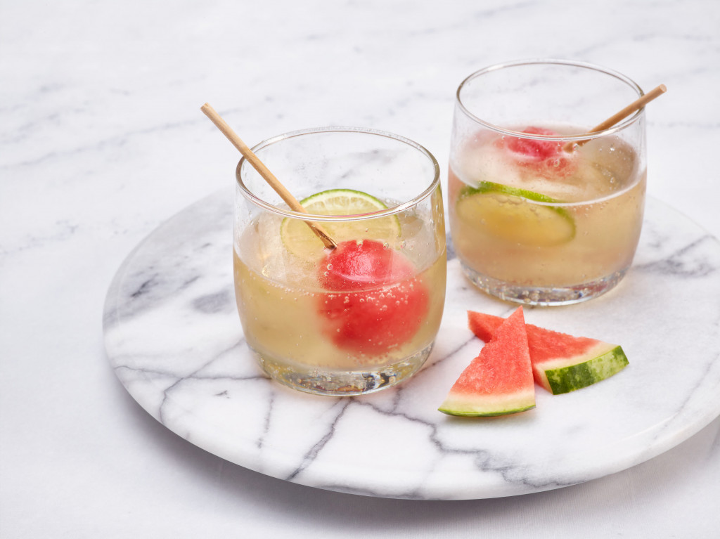 Two glasses of prosecco with frozen watermelon ice pops