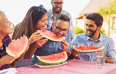 Group of Friends eating watermelon