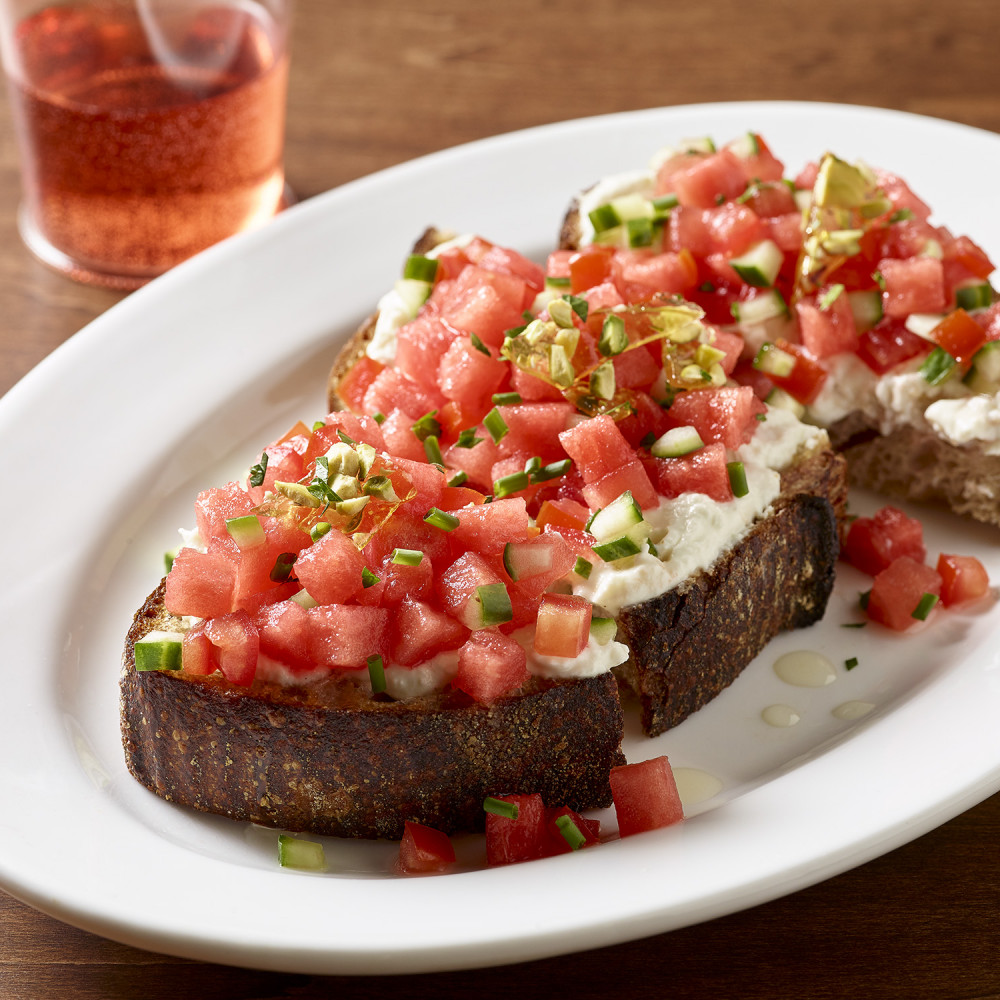 two pieces of bruschetta on a plate