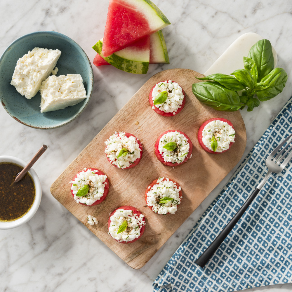 Watermelon Feta Caprese Bites on a Wood Serving Tray