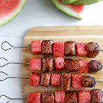 overhead view of watermelon and sausage kabobs