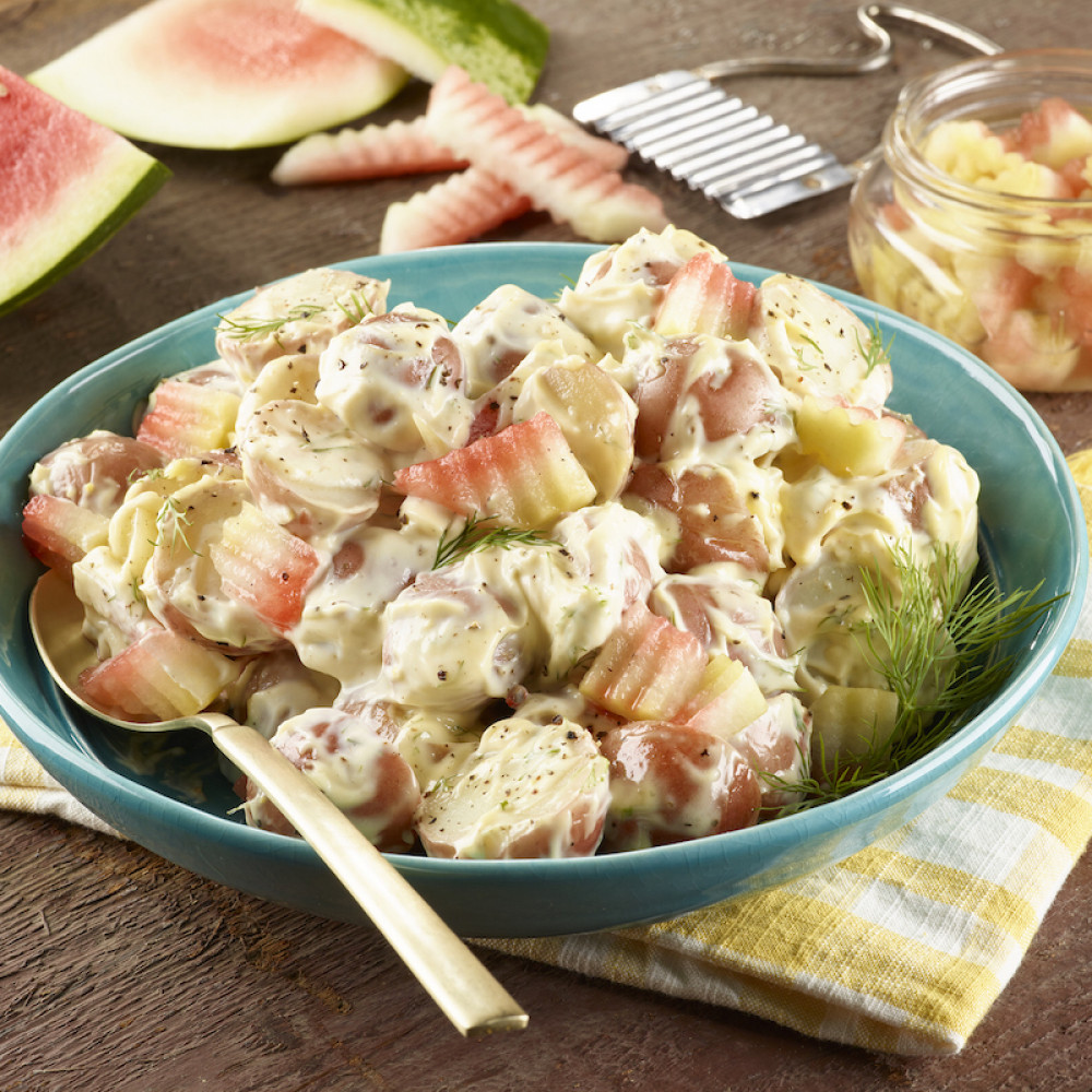 potato salad pickles served in blue bowl