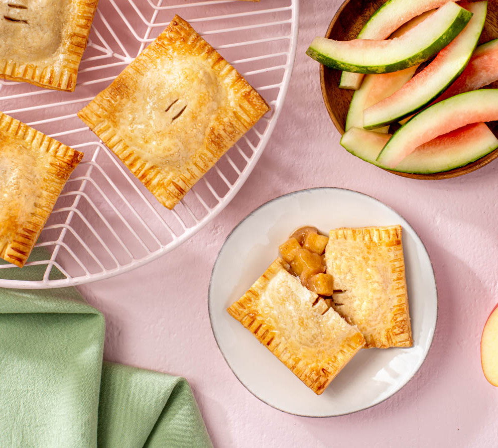 watermelon rind and apple hand pies on a platter and plate
