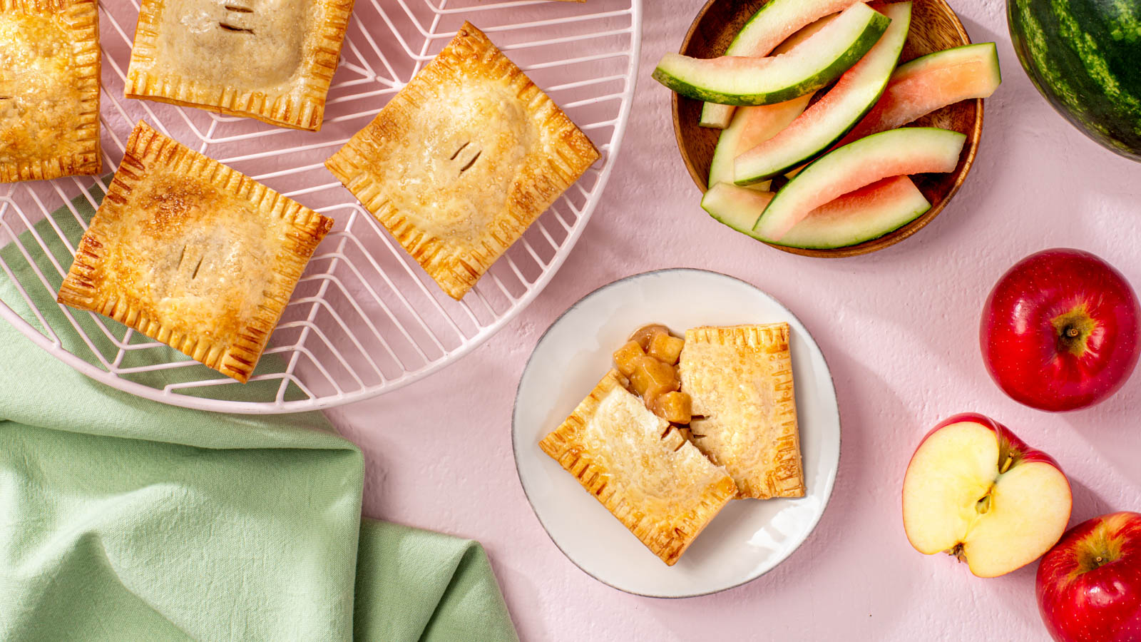 watermelon rind and apple hand pies on a platter and plate