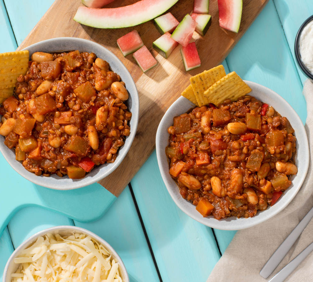 two bowls of chili made with watermelon rind and lentils