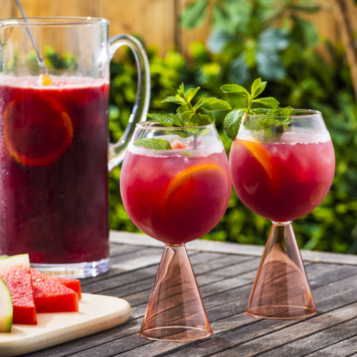 watermelon sangria in glasses on a picnic table