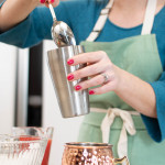 the makings of mule drink with person preparing drink