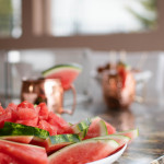 watermelon platter on counter with mule cups in the background