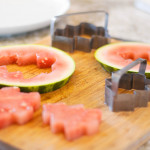 watermelon Christmas cutouts on cutting board with cutter molds