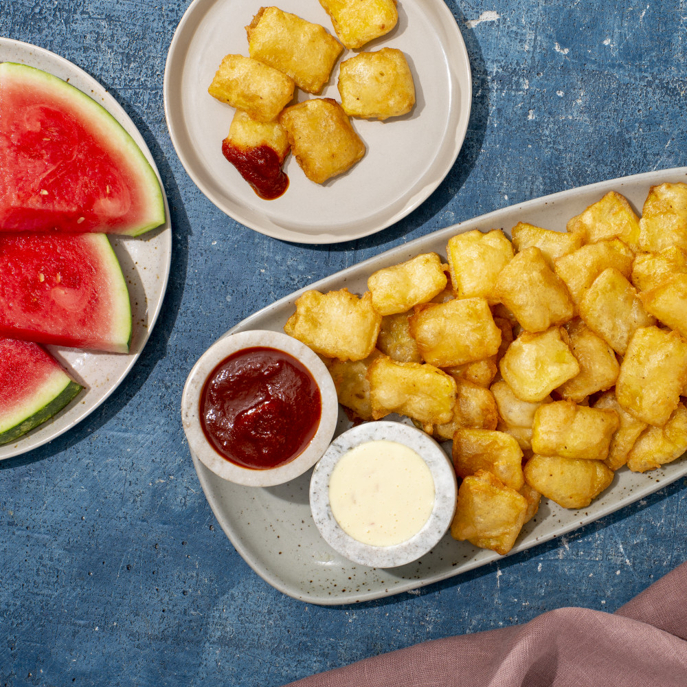 plated recipe with BBQ sauce and aioli, with watermelon wedges and side plate of recipe served