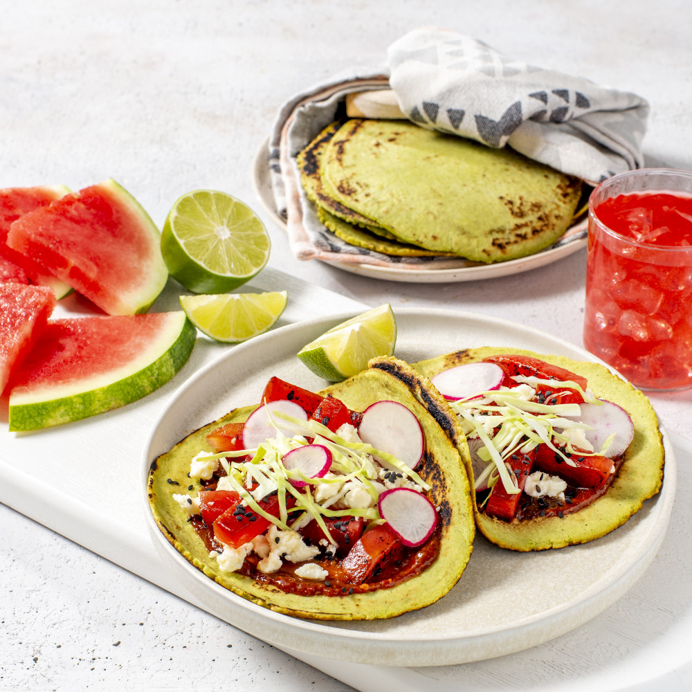 recipe served on tortillas verdes with side of tortilla verdes, watermelon wedges, lime and watermelon drink