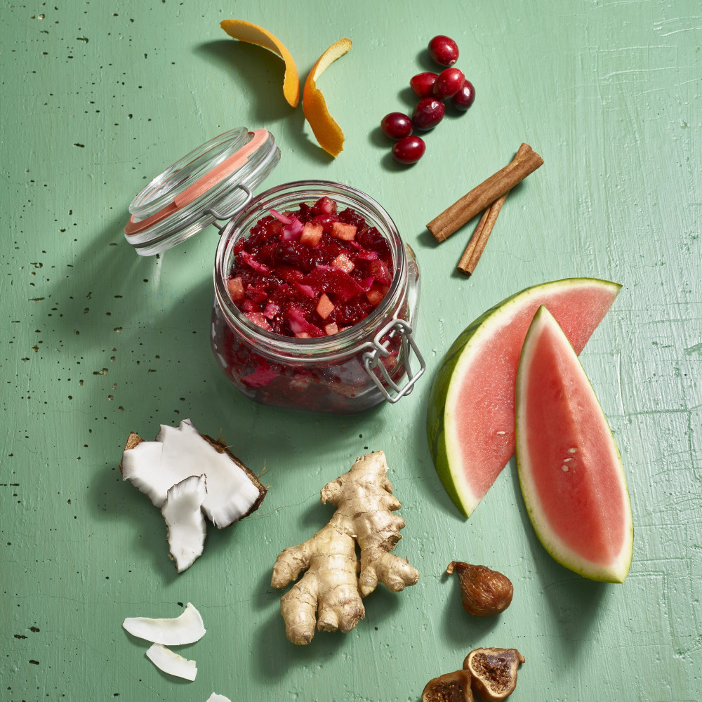 Individual ingredients in watermelon cranberry fig chutney on green background
