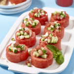 Watermelon cup appetizers with cucumber, mint and feta on serving plate.