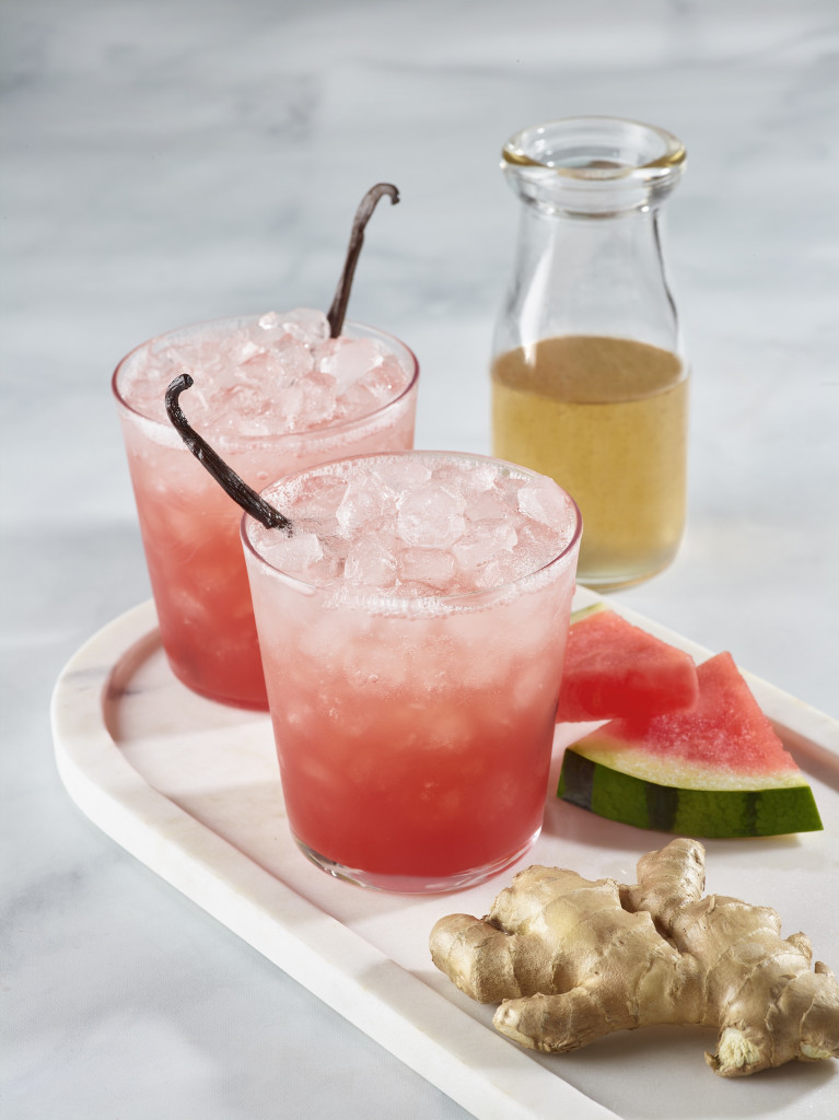 Two watermelon, ginger and vanilla spritz beverages with ice.