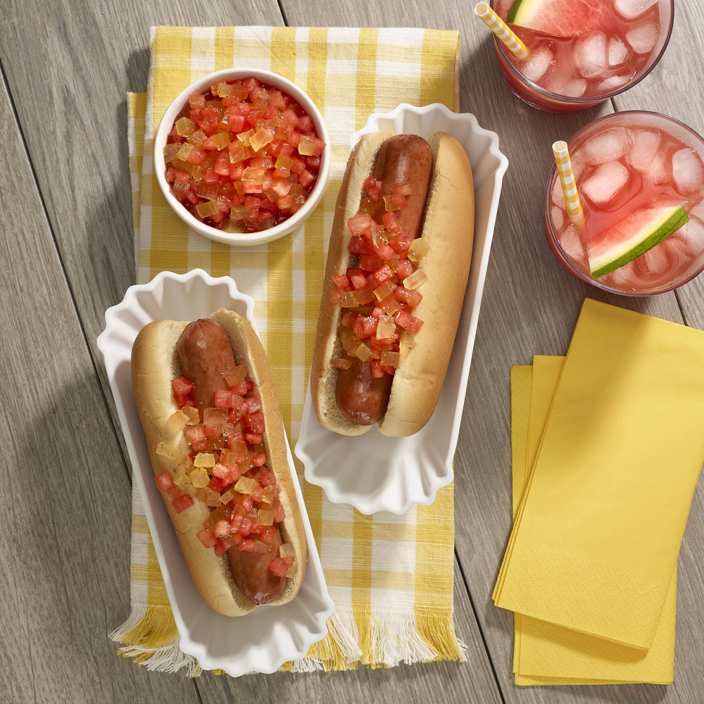 watermelon sweet relish on top of hot dogs with watermelon juice