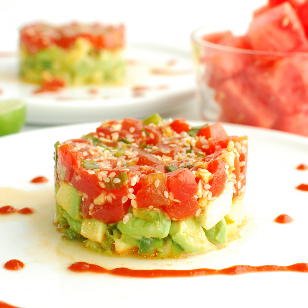 Watermelon Tartare on a plate with watermelon in background