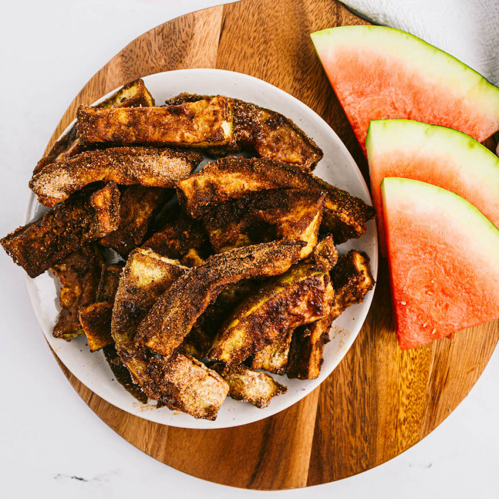 Watermelon Rind Air Fried Churros in a bowl with watermelon slices