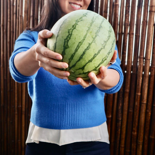 Maggie Moon holding a watermelon.