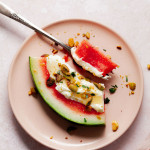 Watermelon with whipped feta, honey, pistachios and fork