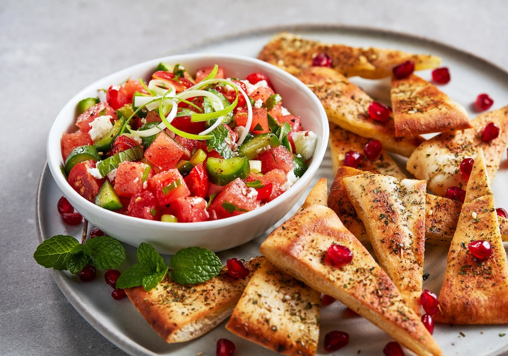 salad/salsa served on platter with wedges of toasted pita chips